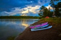 Storm clouds along Hebgen Lake with paddleboard and kayaks Royalty Free Stock Photo