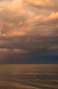 Storm clouds on the Azov Sea, illuminated by the setting sun, the sea horizon Royalty Free Stock Photo