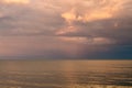 Storm clouds on the Azov Sea, illuminated by the setting sun Royalty Free Stock Photo