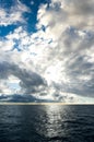 Storm clouds building up over dark blue ocean