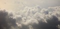 Storm clouds, colorful, heavy on blue sky background. Aerial photo from plane`s window, banner