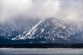 Storm clouds covering the Sierra mountains, the shoreline of Lake Tahoe visible in the foreground Royalty Free Stock Photo