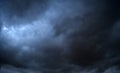 Storm clouds floating in a rainy day with natural light. Cloudscape scenery, overcast weather above blue sky. White and grey Royalty Free Stock Photo