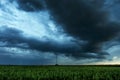 Storm clouds flying over field