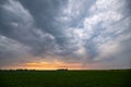 Storm clouds gather over the wide open plains at sunset. Royalty Free Stock Photo