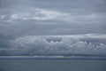 Storm clouds gathering over the deep blue waters of the Gulf of Alaska Royalty Free Stock Photo