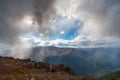 Storm clouds with a gleam of blue sky high in the Altai Mountains Royalty Free Stock Photo