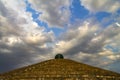 Storm clouds hung over the stone masson pyramid on the Embankment in the center of the Dnepr city