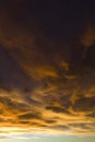 Storm clouds lit by orange sunset