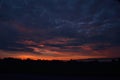 Storm clouds over orange morning dawn sky in NYS Royalty Free Stock Photo