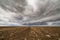 Storm clouds over arable land Royalty Free Stock Photo