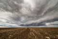 Storm clouds over arable land Royalty Free Stock Photo