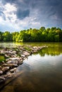 Storm clouds over Centennial Lake, at Centennial Park, in Columbia, Maryland. Royalty Free Stock Photo