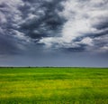 Storm clouds over field Royalty Free Stock Photo