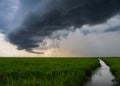 Storm Clouds over Green Grass Marsh Royalty Free Stock Photo