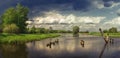 Storm clouds over a lake with a destroyed bridge. Royalty Free Stock Photo