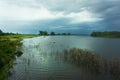 Storm clouds over marsh river Royalty Free Stock Photo