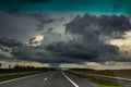 Storm clouds over the road.