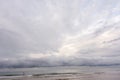 Storm clouds over the sea. Calm and moody seascape with a dramatic sky before storm