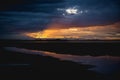 Storm clouds over the water and sunset over the lake Royalty Free Stock Photo