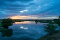 Storm clouds over the water and sunset over the lake Royalty Free Stock Photo