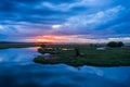 Storm clouds over the water and sunset over the lake Royalty Free Stock Photo