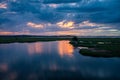 Storm clouds over the water and sunset over the lake Royalty Free Stock Photo