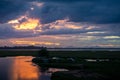 Storm clouds over the water and sunset over the lake Royalty Free Stock Photo