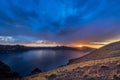 Storm Clouds Push in at Sunset Over Crater Lake Royalty Free Stock Photo