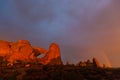 Dramatic sunset colors, clouds and rain in Arches National Park desert Royalty Free Stock Photo