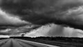 Thunderstorm clouds and rain showers in black and white