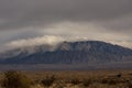 Storm clouds rolling in over the Sandia Mountains in Albuquerque New Mexico Royalty Free Stock Photo