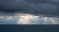 Storm clouds with Sun beam through heavy sky Royalty Free Stock Photo