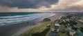 Storm clouds at sunset over homes at the Oregon Coast. Royalty Free Stock Photo