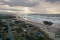 Storm clouds at sunset over homes at the Oregon Coast. Royalty Free Stock Photo