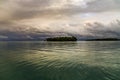 Storm clouds at sunset over little island Royalty Free Stock Photo