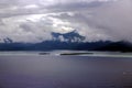 Storm clouds at sunset over little island Royalty Free Stock Photo