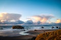 Storm clouds at sunset over rocky beach at Oregon Coast. Royalty Free Stock Photo