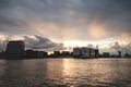 Storm clouds during sunset travel through the city of Amsterdam and give a dramatic atmosphere. Dutch lifestyle