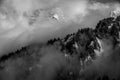 Storm clouds surround snowy mountains in the alps Royalty Free Stock Photo