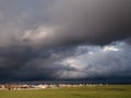 Storm clouds thunderclouds over the village in spring Royalty Free Stock Photo