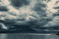 Storm cloudy sky raining over the mountain with lake Royalty Free Stock Photo