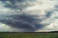 Storm cyclone over summer fields, hills and forests Royalty Free Stock Photo