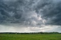 Storm cyclone over summer fields, hills and forests Royalty Free Stock Photo