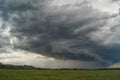 Storm cyclone over summer fields, hills and forests Royalty Free Stock Photo