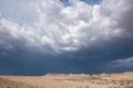 Storm in the distance beyond the mesas Royalty Free Stock Photo