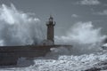 Storm at the Douro mouth north beacon and pier