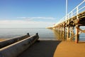 Storm drain next to pier Royalty Free Stock Photo