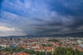 Storm with dramatic clouds over the city of Graz, with Mariahilfer church and historic buildings, in Styria region, Austria Royalty Free Stock Photo