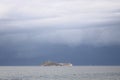 Storm dramatic clouds over the surface of the sea Royalty Free Stock Photo